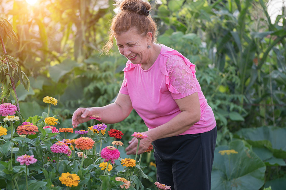 Woman in backyard with flowers